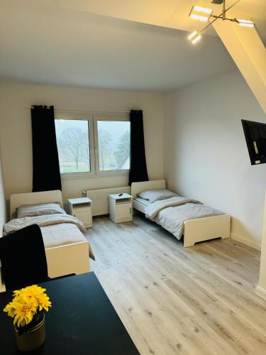 En eller flere senge i et værelse på Private Zimmervermietung Felix