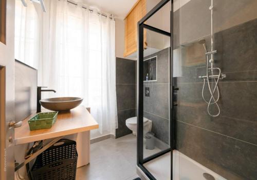 a bathroom with a sink and a shower at SYDNEY in Montargis