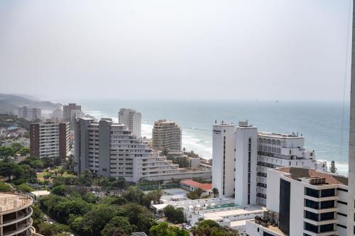 an aerial view of a city and the ocean at Oceans Umhlanga Accommodation in Durban