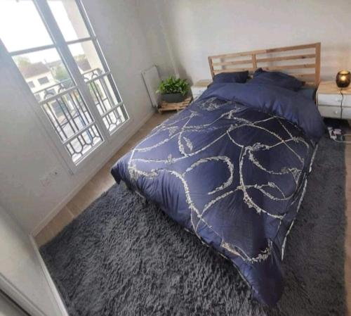 Ein Bett oder Betten in einem Zimmer der Unterkunft Apartement close paris
