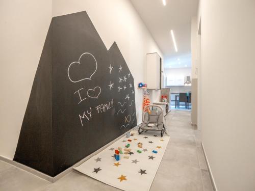 ピエトラ・リーグレにあるBabyaccomodation Family Brightの「家族を愛している」と書かれた黒板