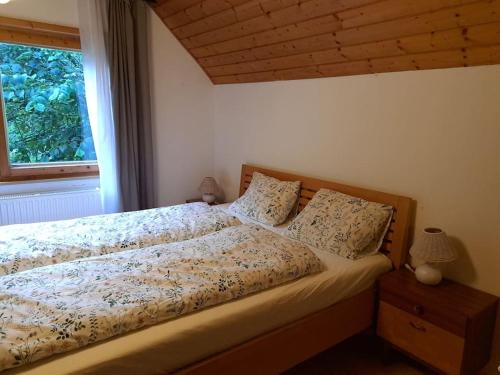 Ένα ή περισσότερα κρεβάτια σε δωμάτιο στο Ferienhaus Chalet Großsölk