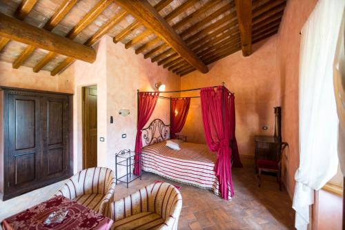 Postel nebo postele na pokoji v ubytování Agriturismo Il Serraglio