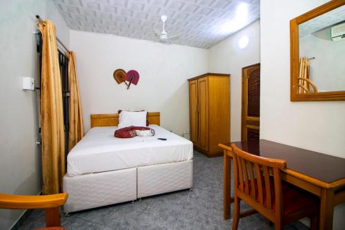 Postel nebo postele na pokoji v ubytování PRESTIGE Guesthouse ,Ksi