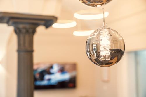 a close up of a glass ball hanging from a ceiling at NEW LUXUS Suite I TWO Kingbeds I Center in Augsburg