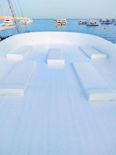 a white boat with a view of the water at VIP Yacht Daily RENT in Sharm El Sheikh