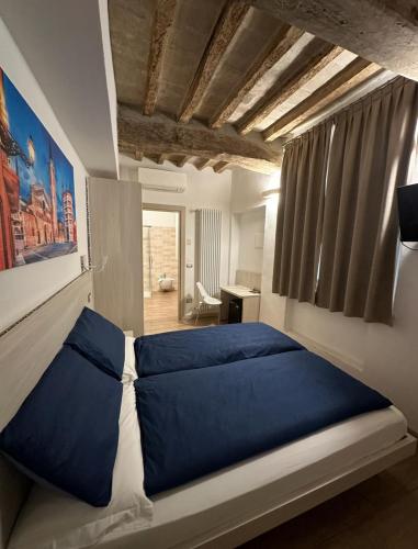 Ένα ή περισσότερα κρεβάτια σε δωμάτιο στο Residenza Pezzani