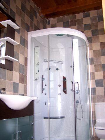 a bathroom with a shower and a sink at Casa Rural Quopiki in Gopegi