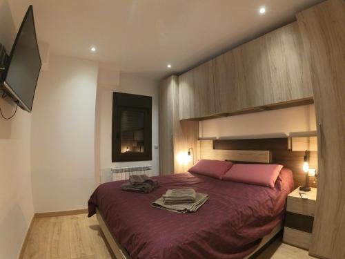 Ένα ή περισσότερα κρεβάτια σε δωμάτιο στο Soldeu Paradis Tarter