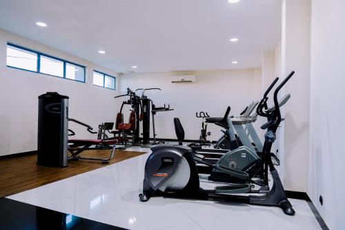 a gym with several exercise bikes in a room at Beira Terrace Hotel in Beira