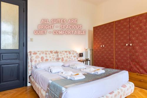 a bedroom with a bed with towels on it at Trieste Centre - Reserved Parking & Wi-Fi in Trieste