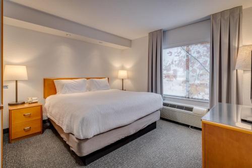 a hotel room with a bed and a window at Fairfield Inn & Suites by Marriott Lawton in Lawton