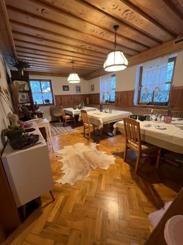 a large dining room with tables and chairs at Villa Blumegg in Hermagor