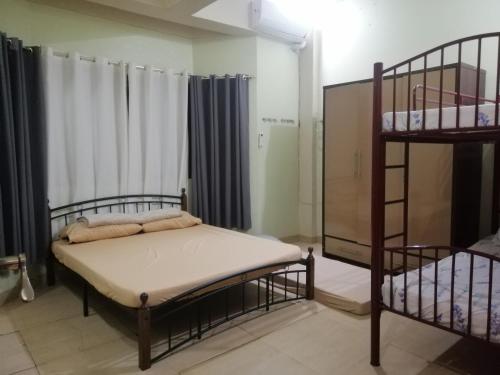 a bedroom with two bunk beds in a room at JD Homestays CDO in Cagayan de Oro