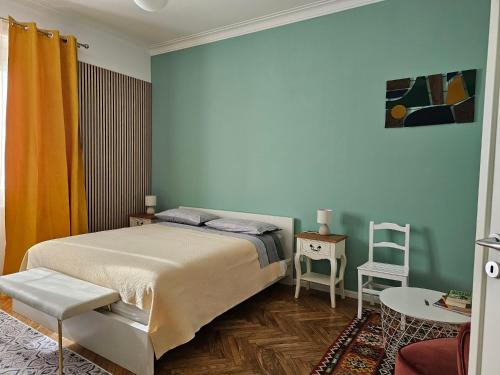 a bedroom with a bed and a table and chairs at Casa Torino Liberty in Turin