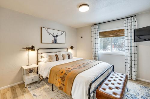 a bedroom with a large bed and a window at Downtown Cascade Vacation Rental Less Than 1 Mi to Lake! in Cascade