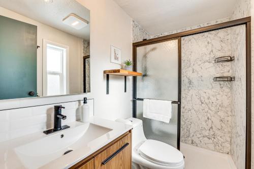 a bathroom with a shower and a toilet and a sink at Downtown Cascade Vacation Rental Less Than 1 Mi to Lake! in Cascade
