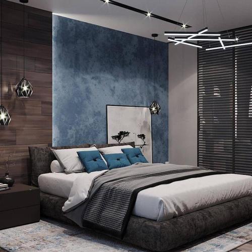 タルディコルガンにあるSunrise Hotelのベッドルーム(青い枕の大型ベッド1台付)