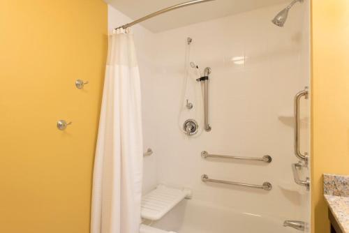 a bathroom with a shower with a white shower curtain at TownePlace Suites by Marriott Lexington South/Hamburg Place in Lexington