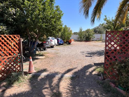 a parking lot with a orange cone and cars parked at Culturia Lodge in Putaendo