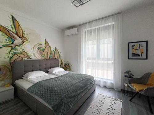 Ένα ή περισσότερα κρεβάτια σε δωμάτιο στο Apartament Maia Baile Felix