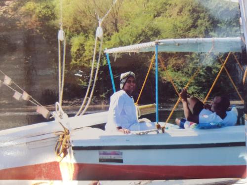 a group of people on a boat on the water at Felucca Sailing Boat Overnight Experience in Aswan