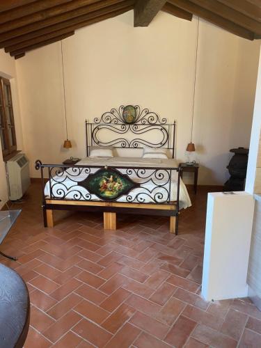 En eller flere senge i et værelse på Villino Glicine