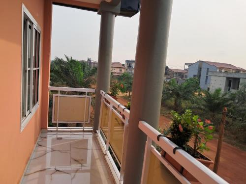 a balcony of a house with a view at APPARTEMENT NEW STANDING CITE CHIRAC YASSA in Yapoma