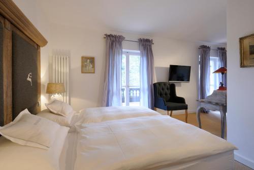 Postel nebo postele na pokoji v ubytování Boutique Hotel Relais Chalet Wilhelmy