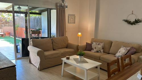 a living room with a couch and a table at La casita de Mon - Radazul in Radazul