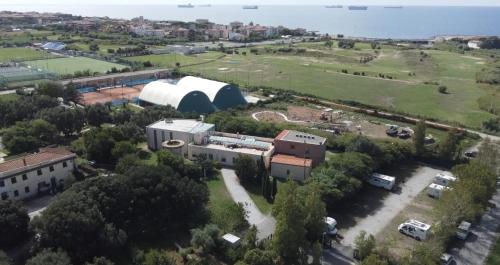 an aerial view of a large building with a field at Guest House Parco del Mulino in Livorno