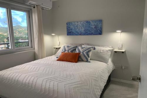 Voodi või voodid majutusasutuse Oceanview Marisule Ridge toas