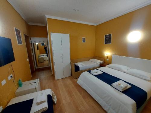 Postel nebo postele na pokoji v ubytování Hotel Positano 2