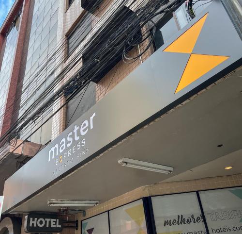 a hotel sign on the side of a building at Master Express Alberto Bins - 200 metros do Hospital Santa Casa in Porto Alegre