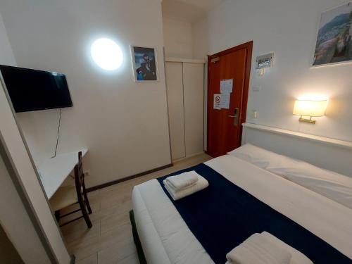 Postel nebo postele na pokoji v ubytování Hotel Positano 2