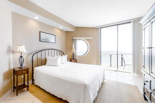Postel nebo postele na pokoji v ubytování Surfside Resort