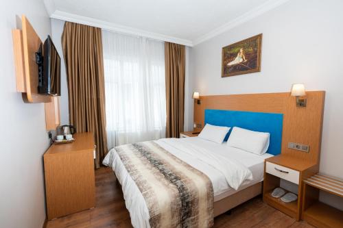 Ένα ή περισσότερα κρεβάτια σε δωμάτιο στο Seatanbul Hotel