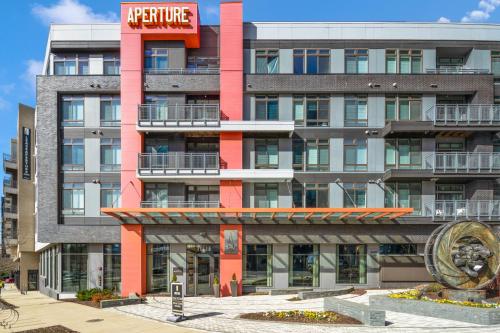 a large building with a red architecture sign on it at Global Luxury Suites at Reston in Reston