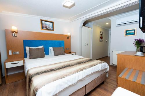 Ένα ή περισσότερα κρεβάτια σε δωμάτιο στο Seatanbul Hotel