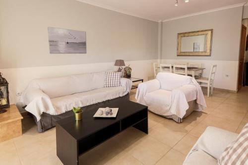 a living room with a couch and a table at Mareva's house in Vromerí