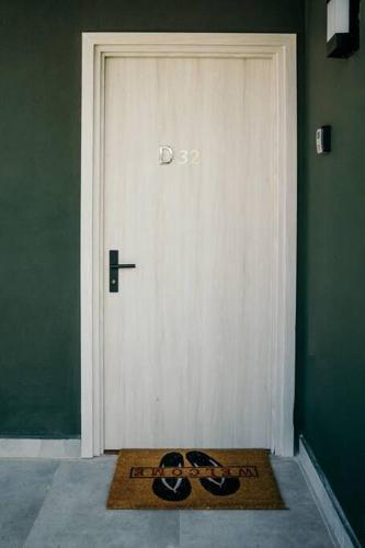 a pair of shoes sitting in front of a door at LUXURY Apartment in BLUE Playa Venao D-32 in Playa Venao