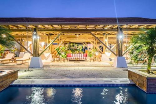 a house with a swimming pool and a patio at LUXURY Apartment in BLUE Playa Venao D-32 in Playa Venao