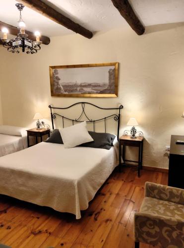 Ένα ή περισσότερα κρεβάτια σε δωμάτιο στο Hotel Restaurante Las Buitreras
