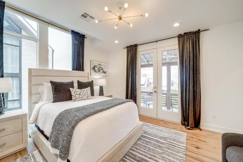 a bedroom with a large bed and windows at Carlton Landing Home at Lake Eufaula! in Eufaula