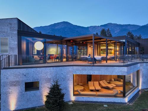 a large house with a lot of glass at Collina Luxury Relais in Clusone
