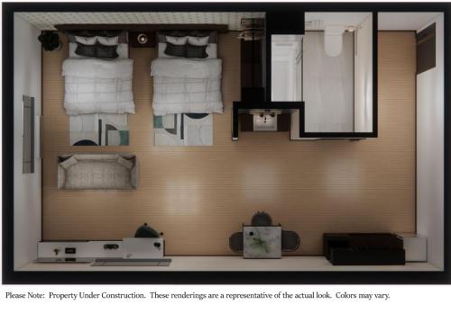 uma representação de um pequeno quarto com toalhas em eStudio Suites em Plainfield