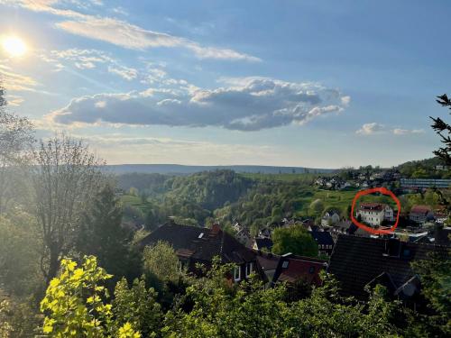 a view of a village with a red circle at Ferienwohnung Daisy in Sankt Andreasberg