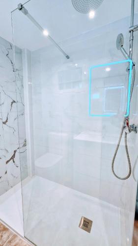 a shower with a glass door in a bathroom at Atlantico Flamingo in Calpe
