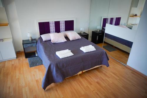 a bedroom with a bed with two towels on it at Apartamento amoblado tipo loft in Buenos Aires