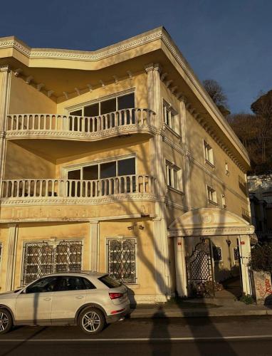a white car parked in front of a house at BOSPHORUS in Sarıyer